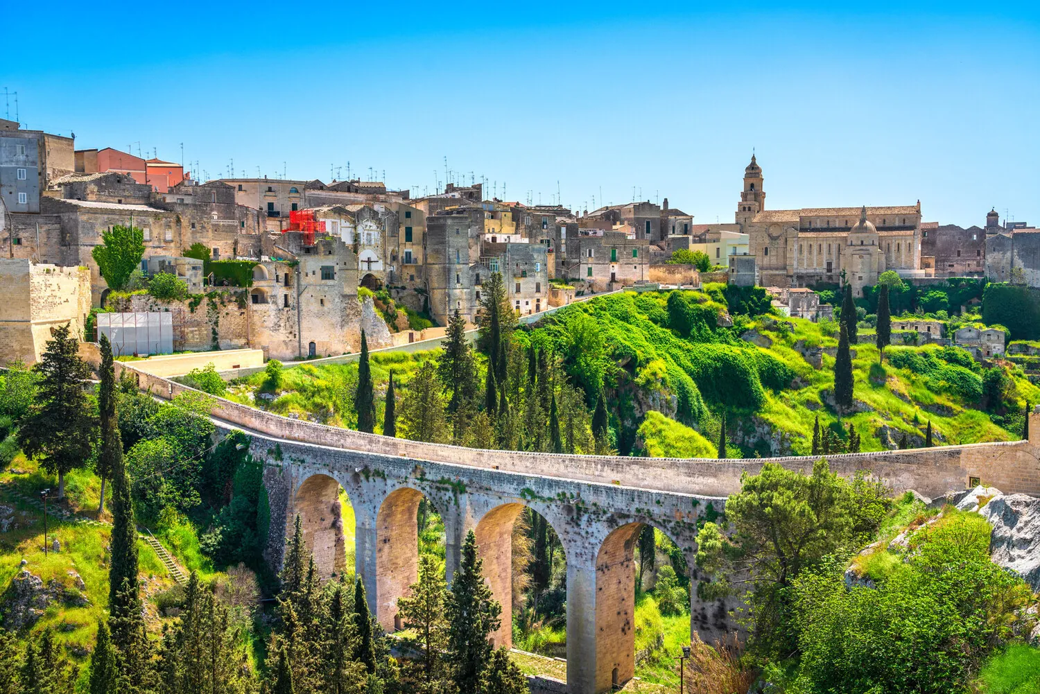 The old town and aqueduct bridge at Gravina in Puglia, in the region where we plan weddings