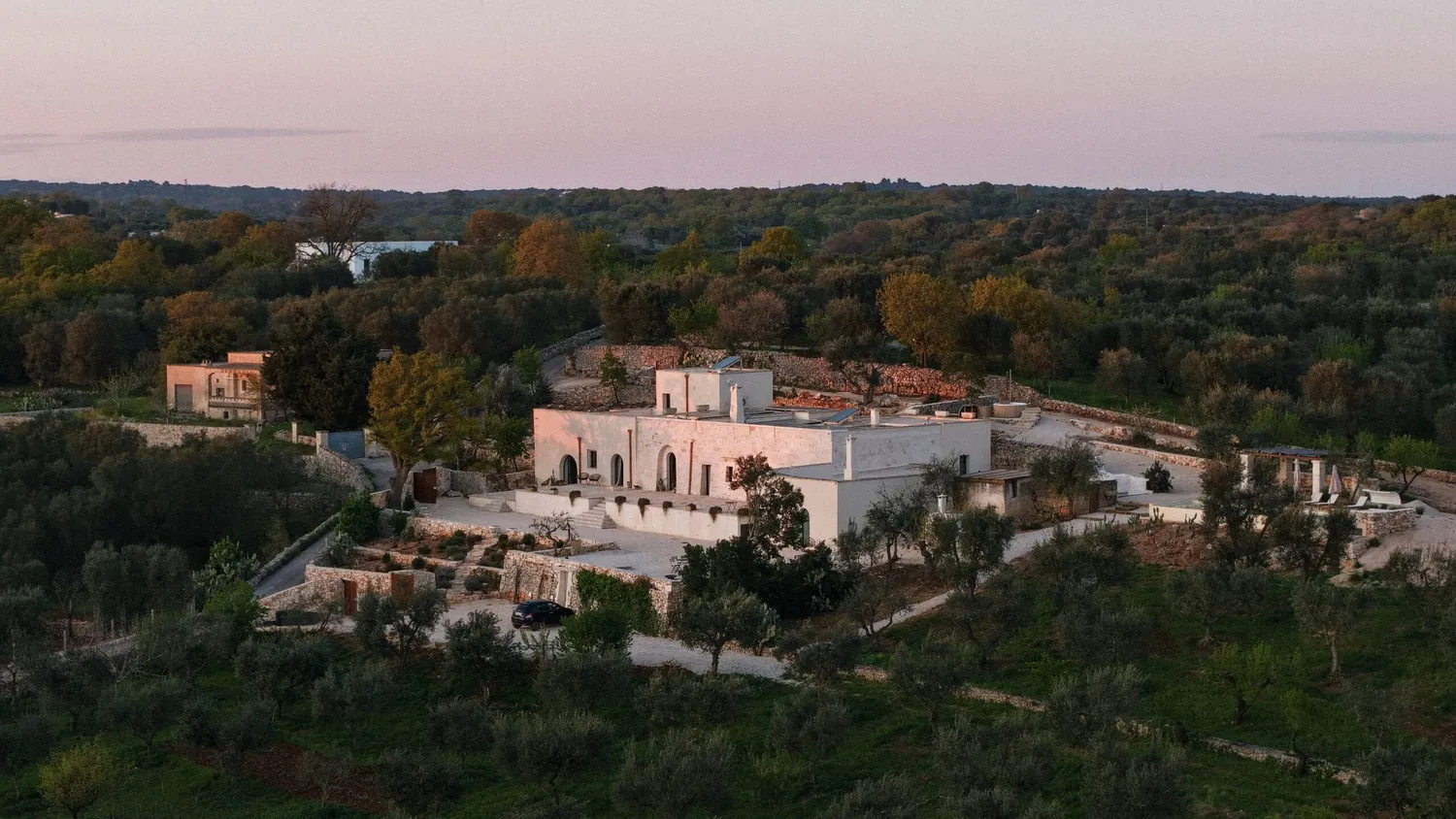 Villa Rocca 1914 at dusk, a hilltop wedding venue surrounded by olive groves near Ostuni, Puglia