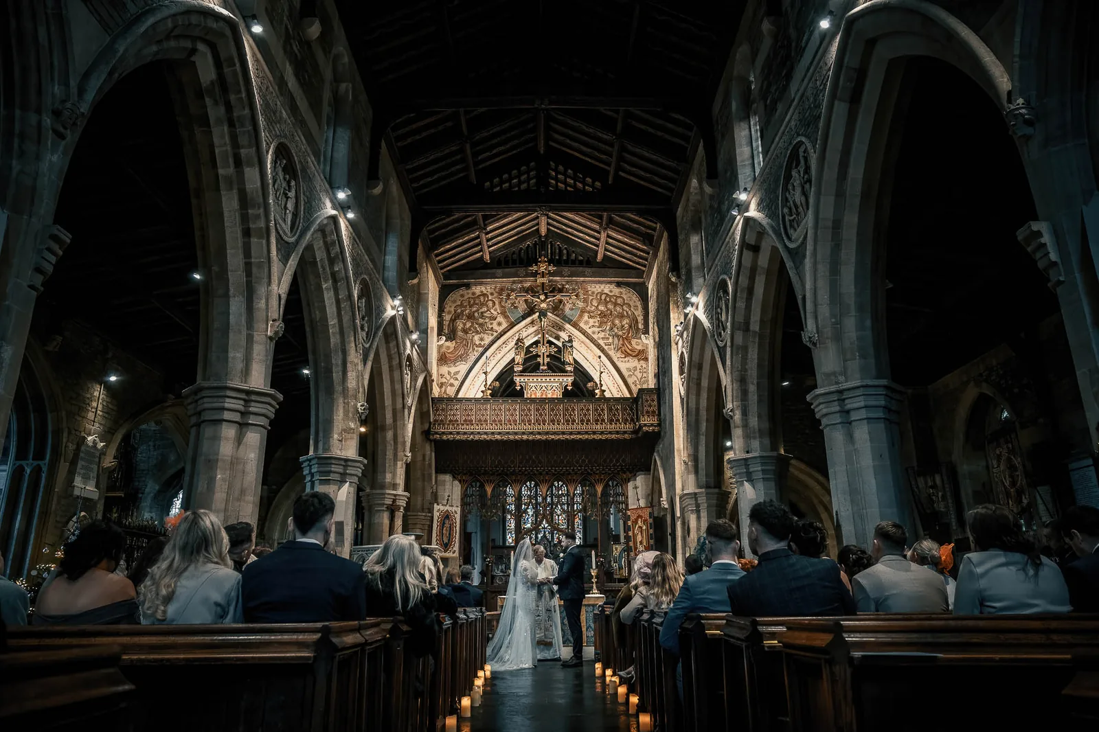 A candlelit church wedding ceremony planned by Swish Soirées